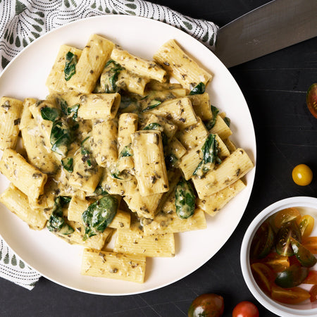 Creamy spinach alfredo rigatone made with Sonoma Gourmet