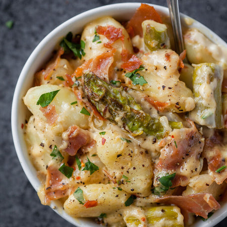 Cauliflower alfredo gnocchi with asparagus & prosciutto made with Sonoma Gourmet