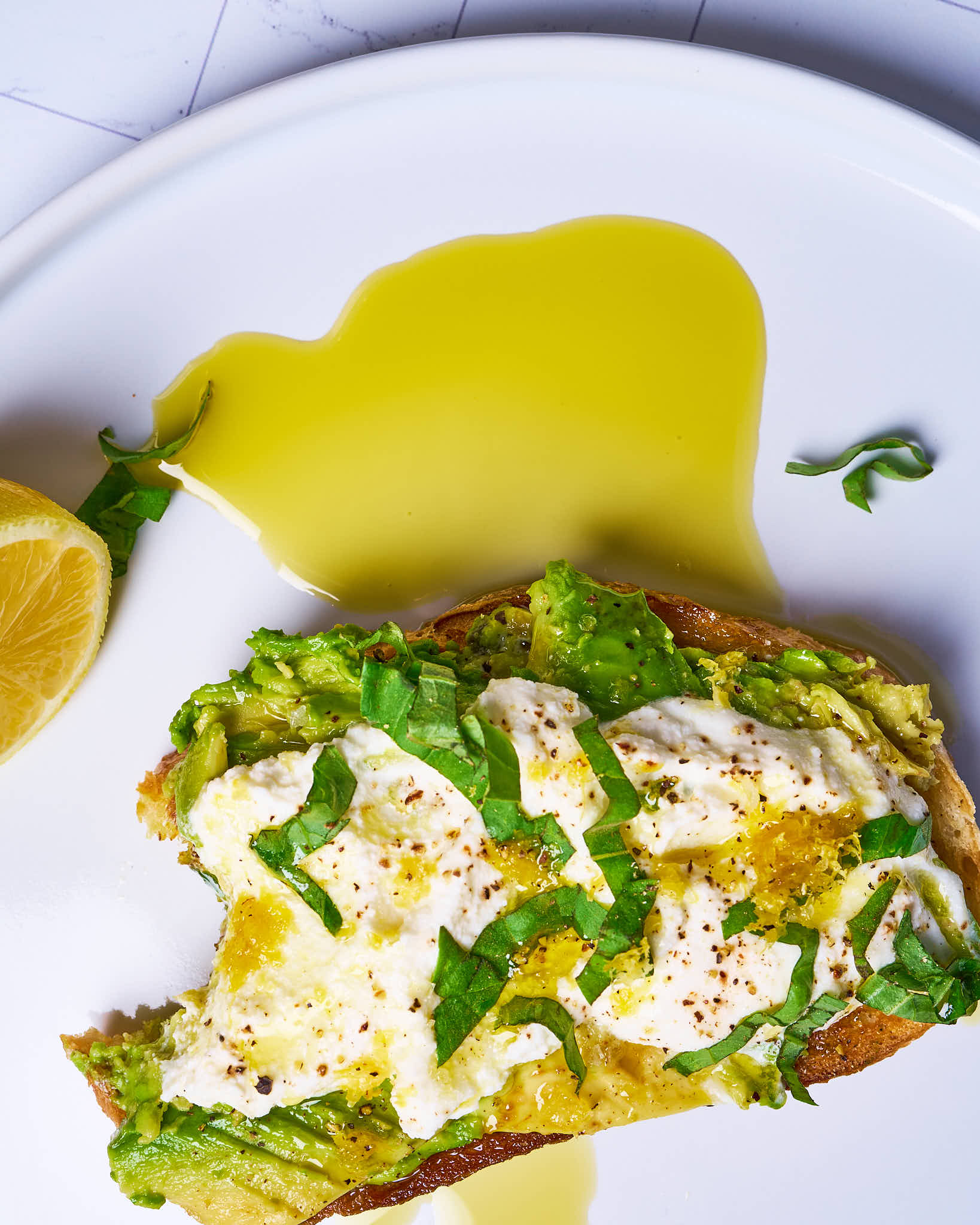 Avocado toast with ricotta, lemon zest, and basil made with Sonoma Gourmet